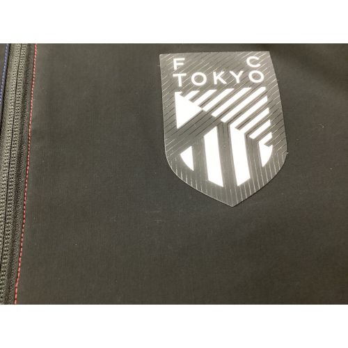 FC東京 (エフシートウキョウ) サッカーウェア SIZE M ブラック プレミアストレッチウーブンジャケット ニューバランス AMJ45242